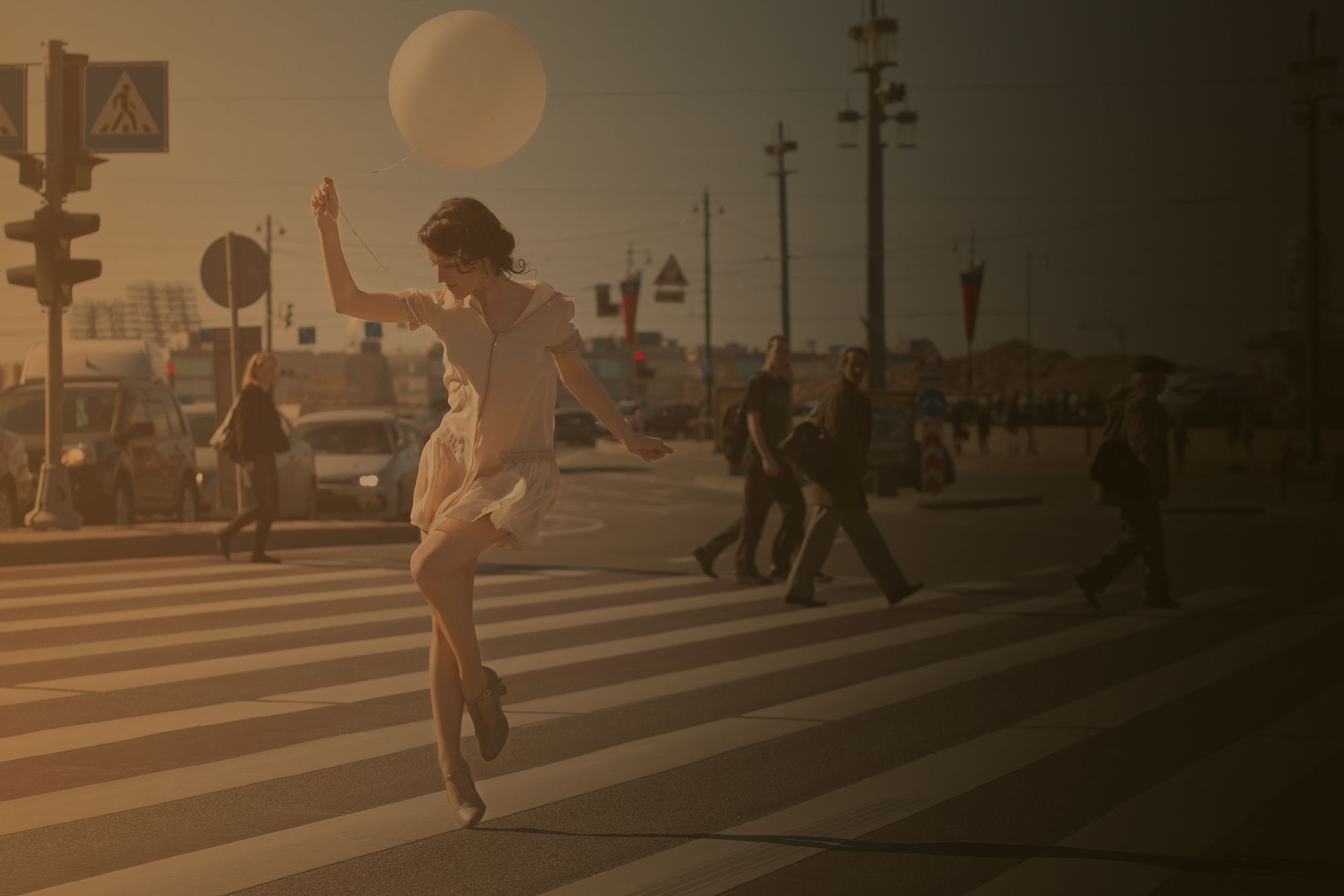 Photo of Ksenia swing dancing in the street sepia St Petersburg