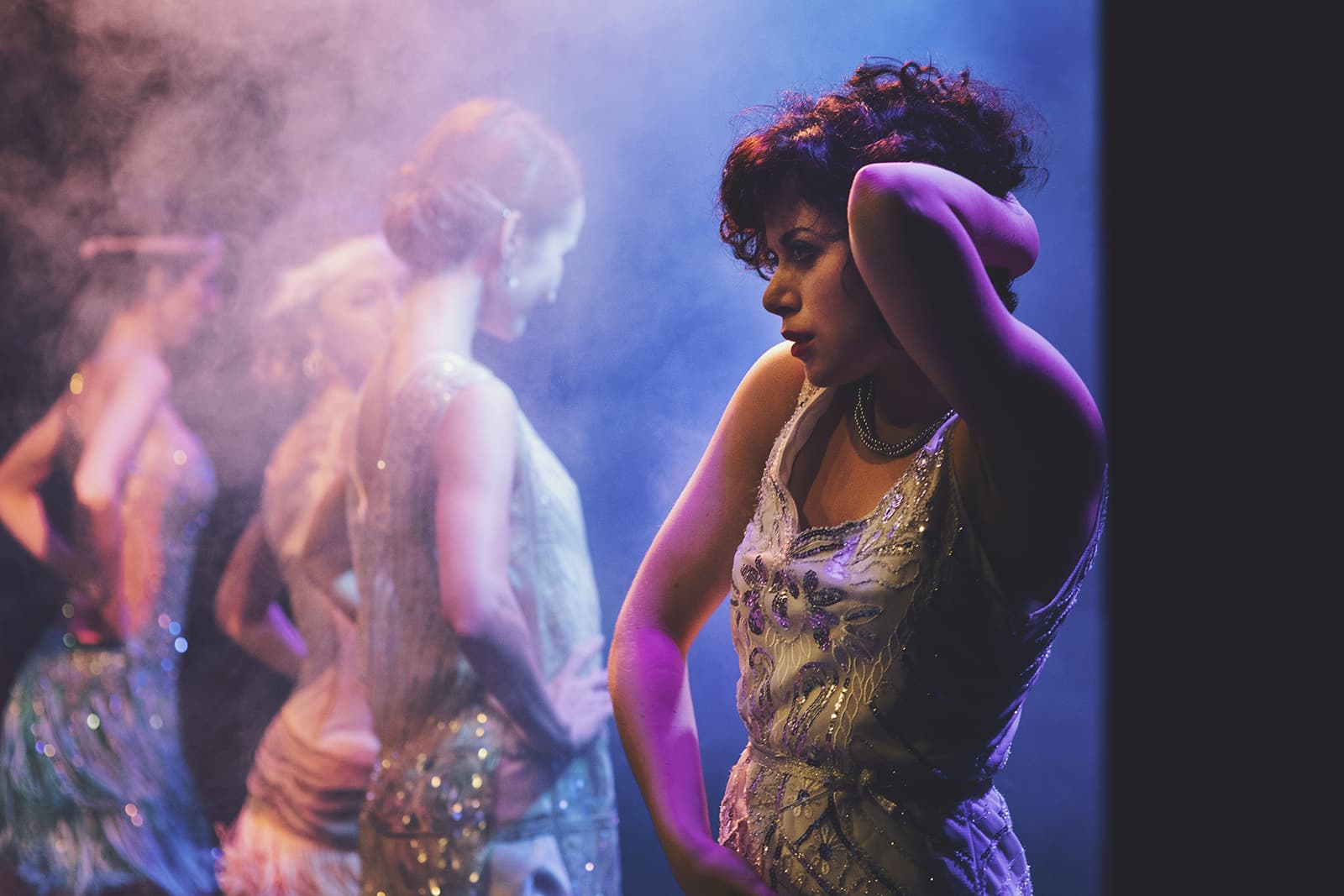 Photo of young female swing dancer Alinda Miron solo jazz dancing at a social swing dance event